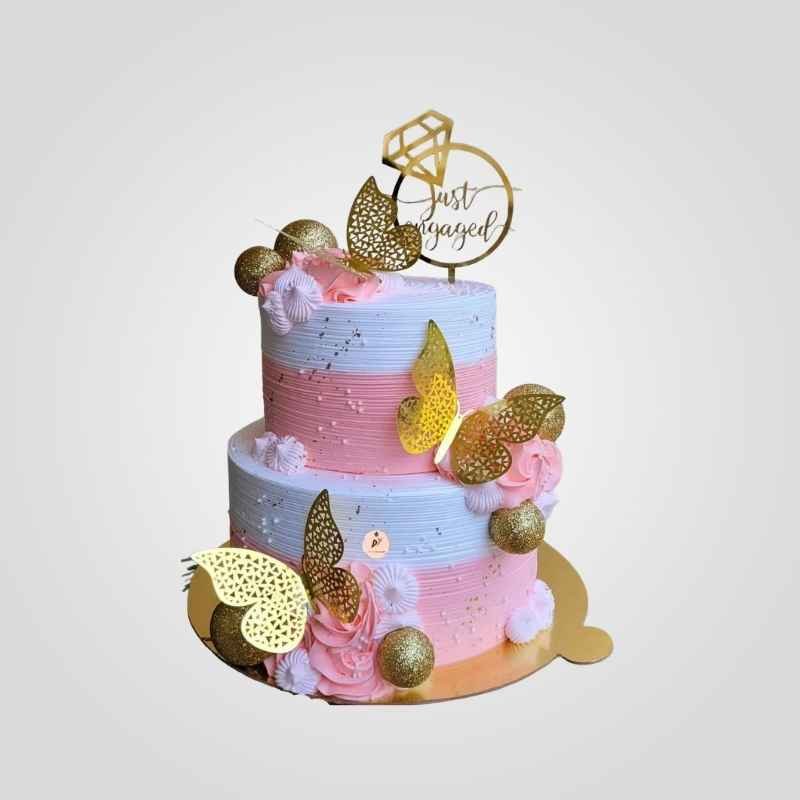Pink and gold two-tier engagement cake