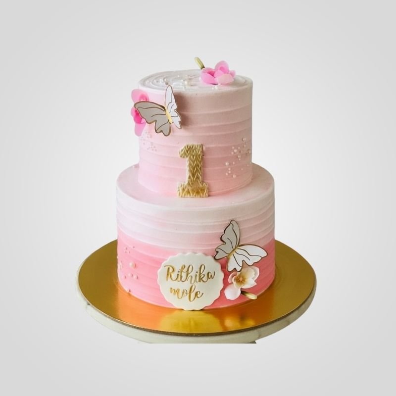 Pink two-tier 1st birthday cake